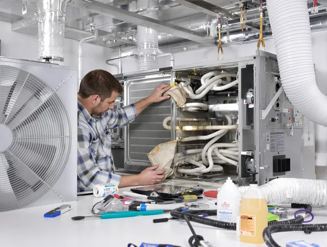 Grafton Air Duct Cleaning specialist performing precision AC coil cleaning in Grafton