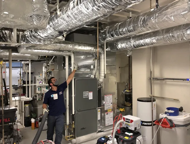 Grafton Air Duct Cleaning specialist performing thorough furnace duct cleaning in a Grafton residence