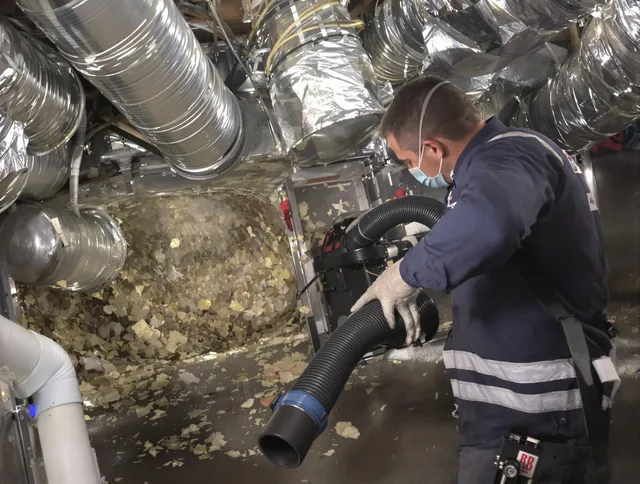 Grafton Air Duct Cleaning specialist operating negative pressure cleaning equipment for thorough duct maintenance in Grafton