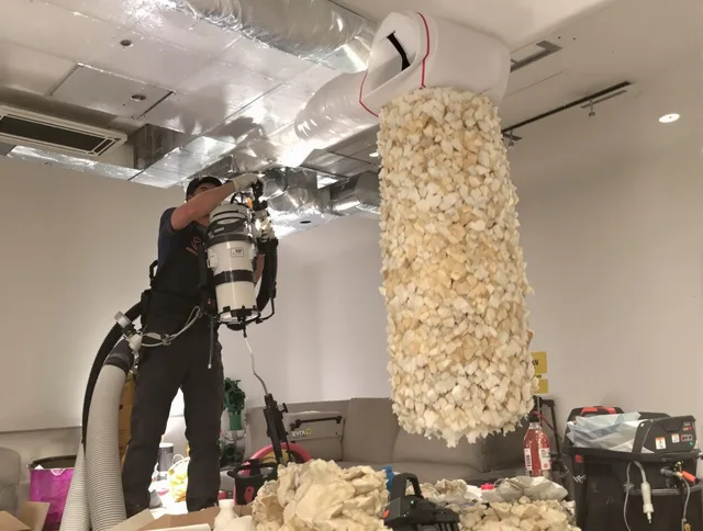 Grafton Air Duct Cleaning technician performing precision vacuum insulation removal in a residential property in Grafton